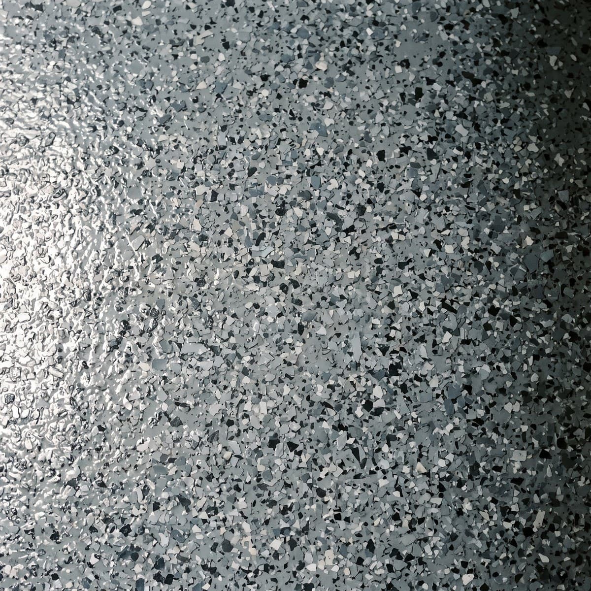 Close view of the same gray, black and white blend in the medium chip size, each chip readable on its own